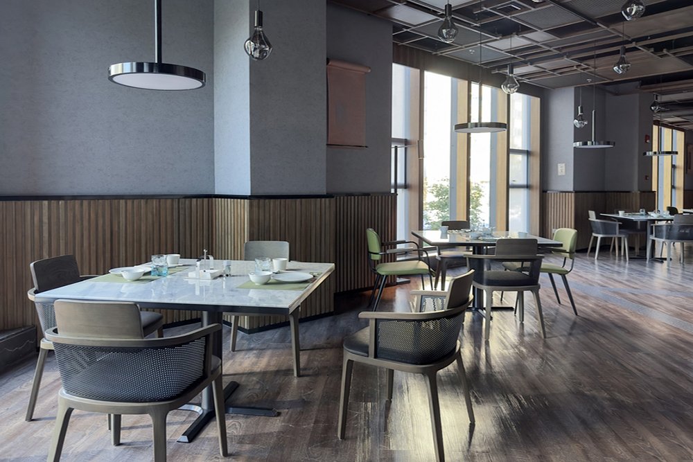 Bulk Order 11 Restaurant interior, part of hotel, modern style design.The table has been set with wine glasses, knives and forks, and white china plates.